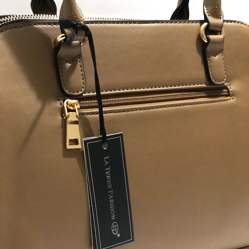 Woman’s purse tan color with shoulder strap